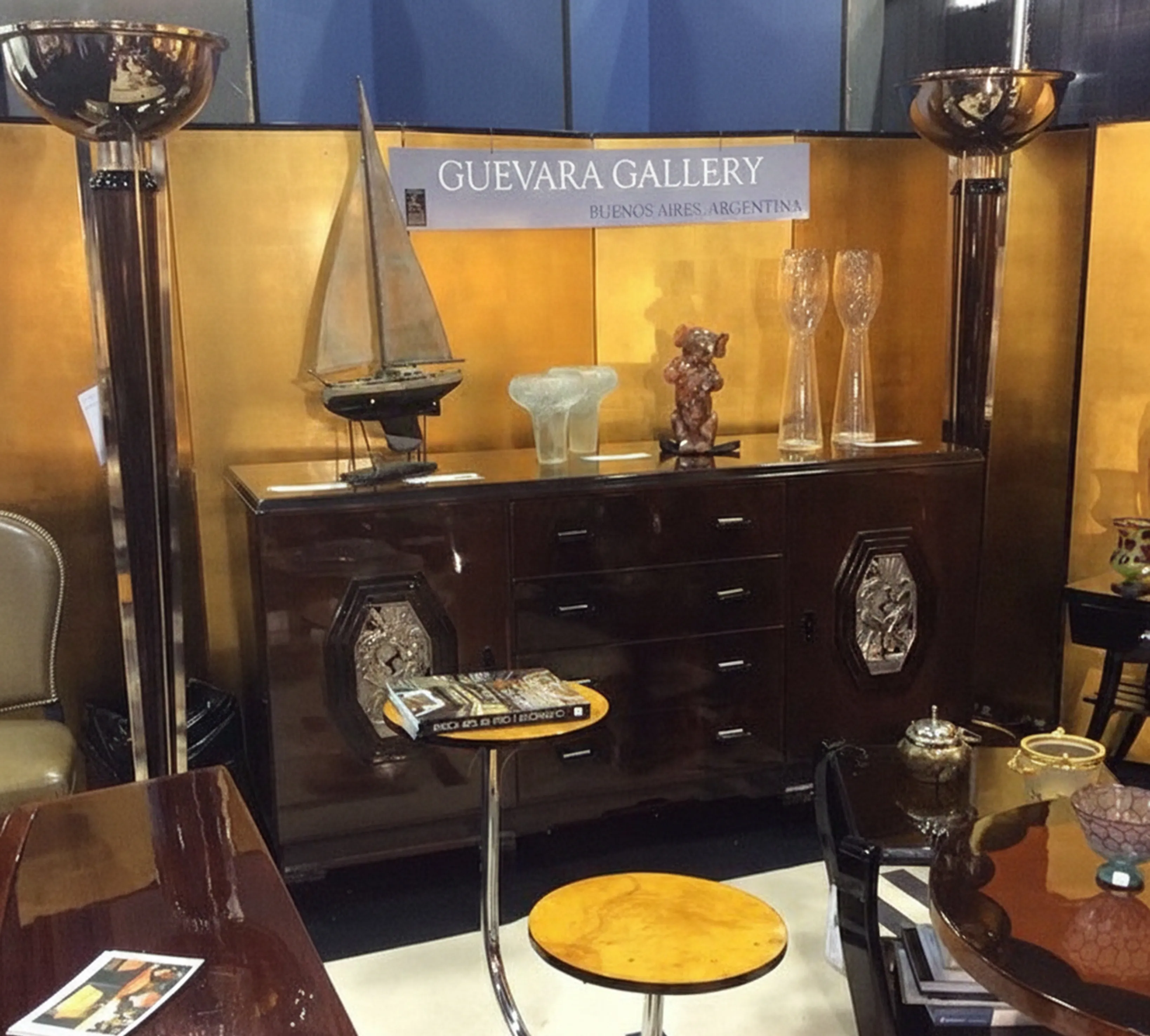 Antique collectible ship in an elegant setting with other items.