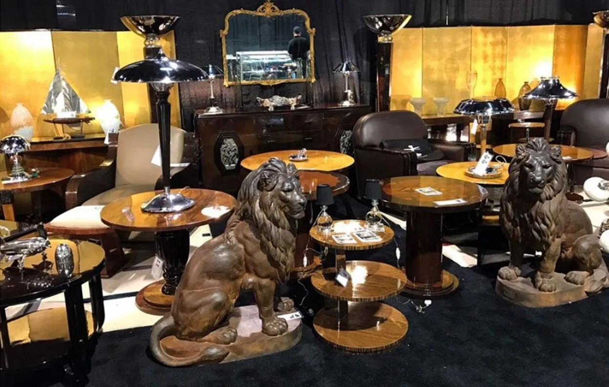 Two decorative lions in an antique display