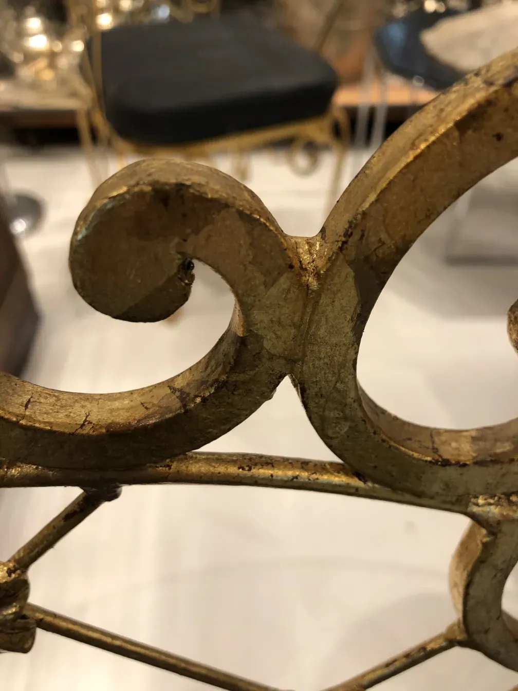 antique garden armchairs with curved golden design