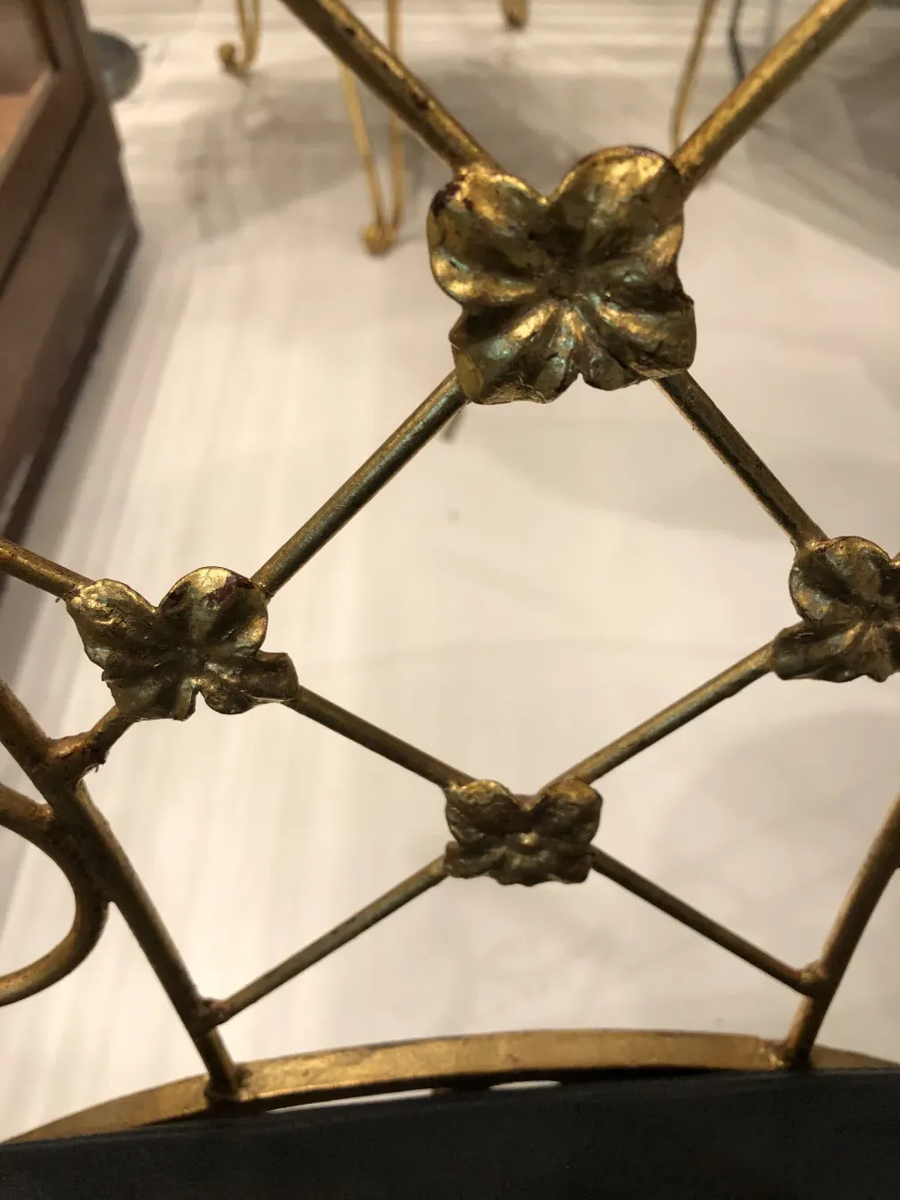 Detailed view of 2 vintage garden chairs with floral accents