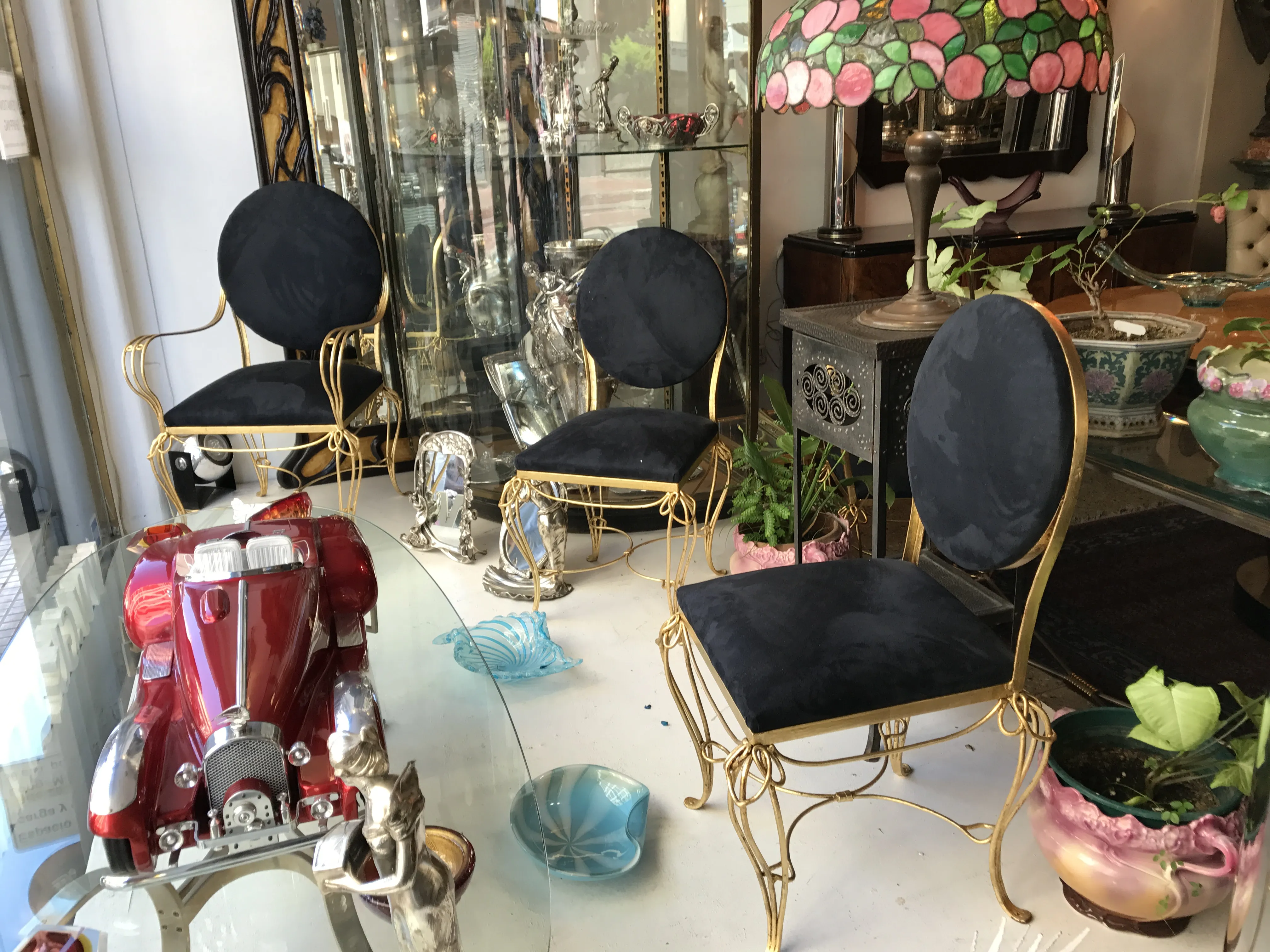 antique dining table for six people featuring Art Nouveau style, with decorative chairs in the background