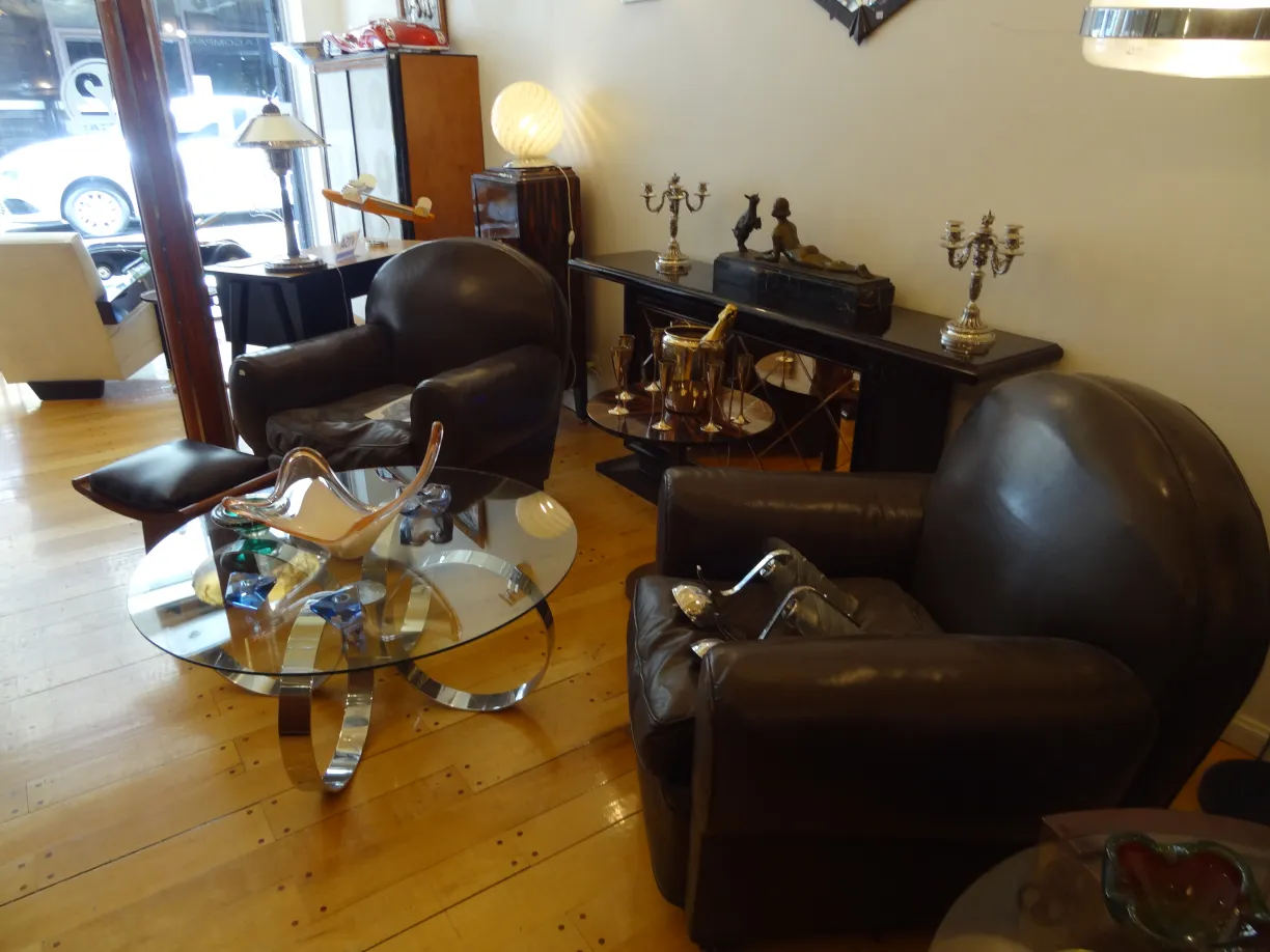 two classic antique armchairs in a modern living space