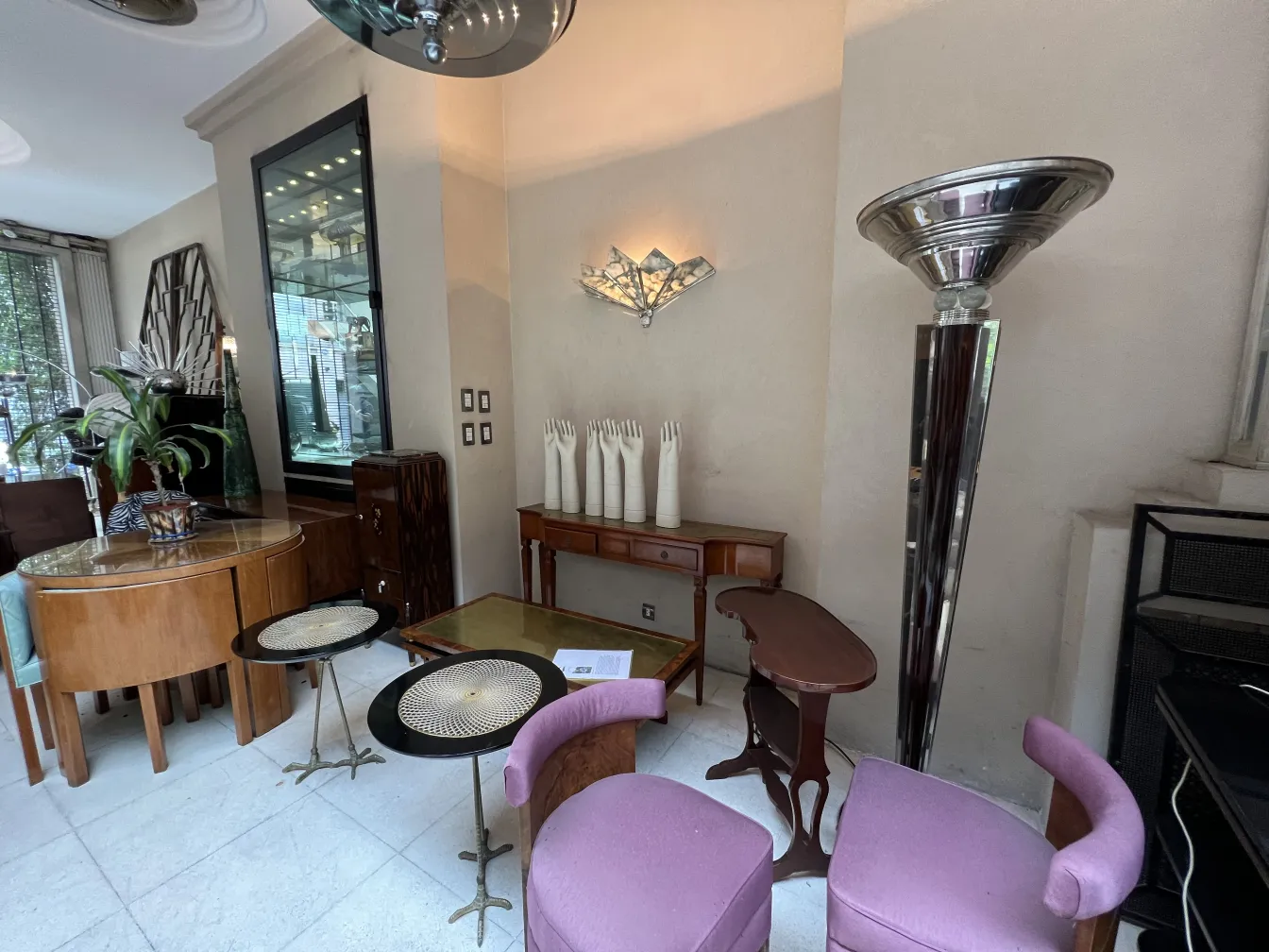 two purple antique armchairs in a modern setting