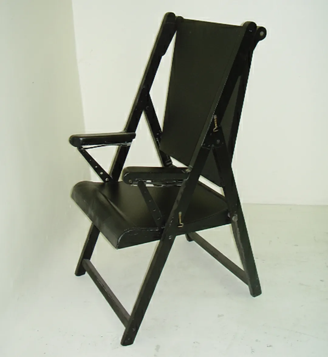 two antique armchairs in a neutral setting