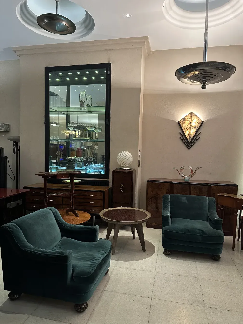 Two antique armchairs with a soft design in an elegant setting.