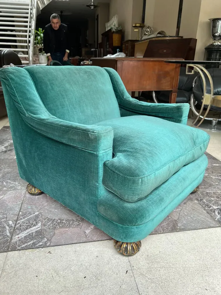 antique green armchairs with decorative legs in a classic setting