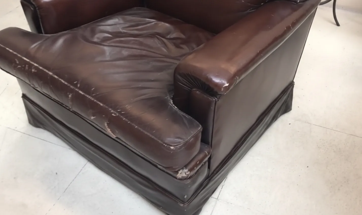 Worn antique armchairs, perfect for restoration. Light background.