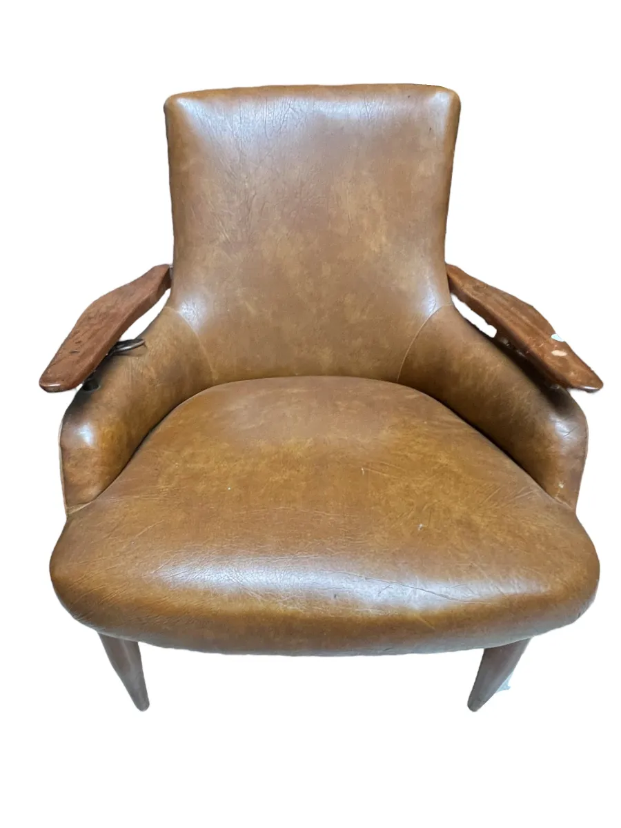 two antique armchairs by finn juhl with a simple design, light brown color, wooden arms