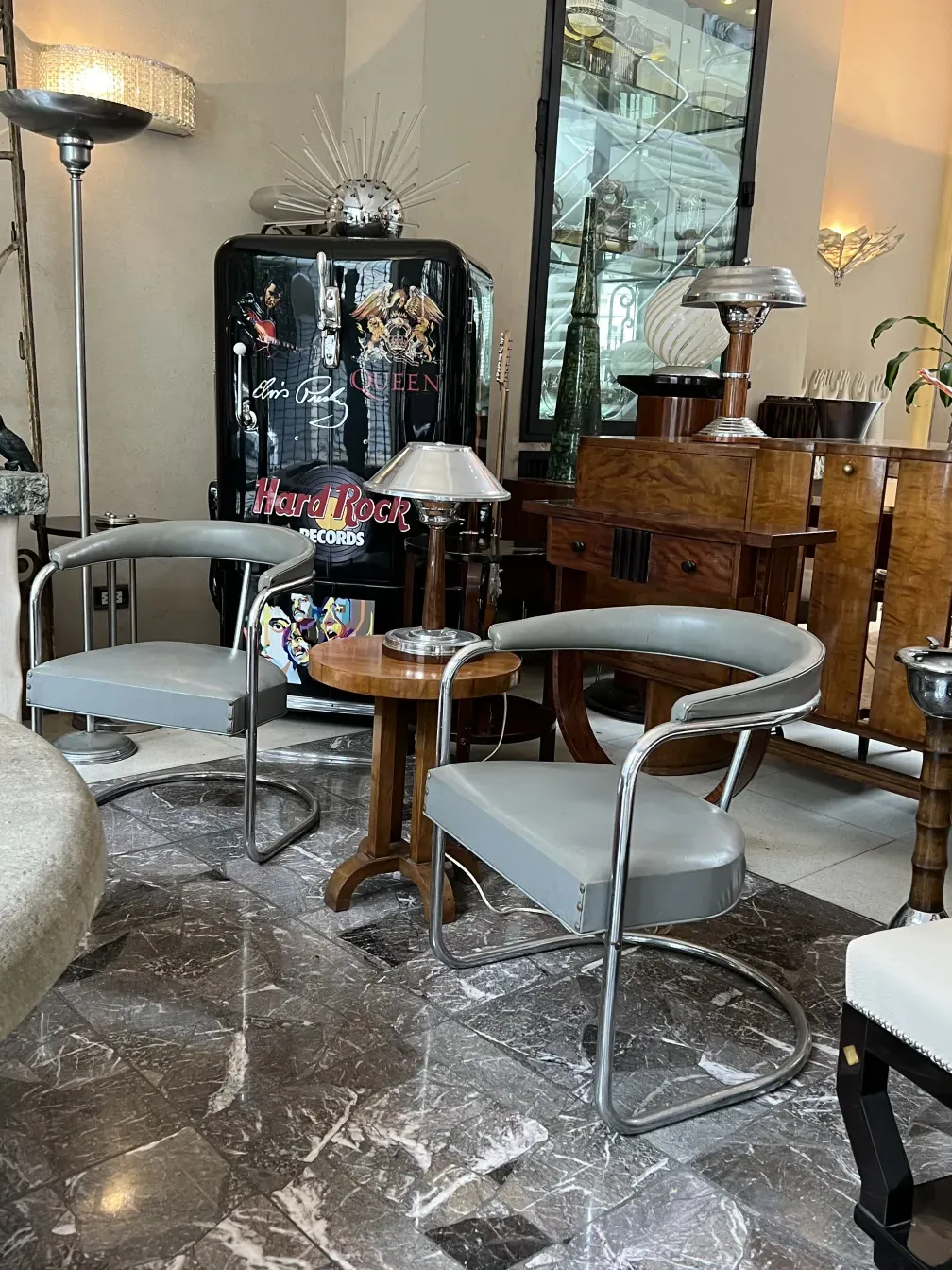 two antique armchairs to be restored, featuring an elegant design surrounded by vintage decor