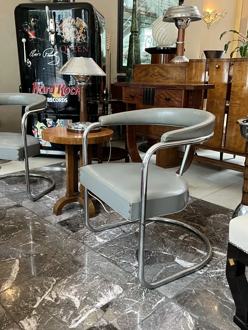 two antique armchairs to be restored, in a vintage setting, with modern details.