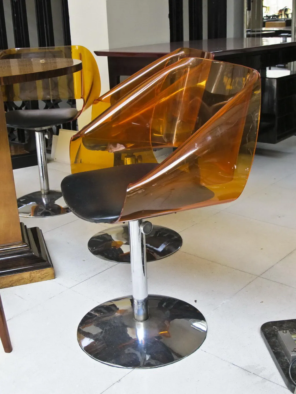 4 antique amber chairs in a modern setting