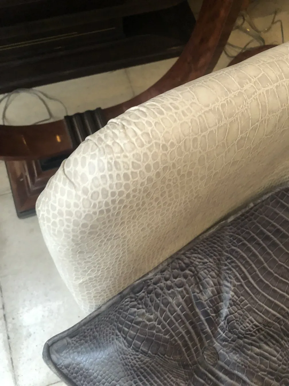 Antique armchair with a unique and elegant design, part of a cozy setting.