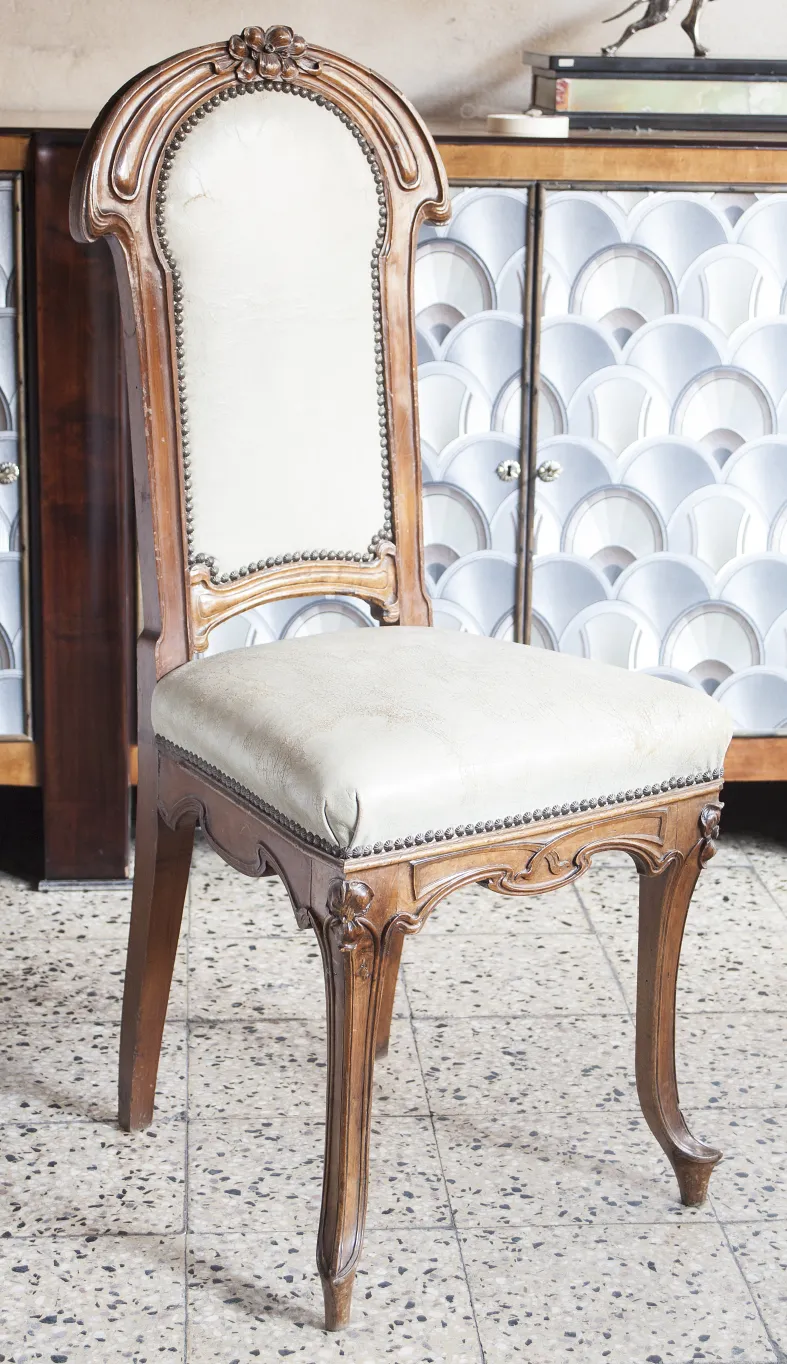 antique chair with an ornate back in an elegant setting