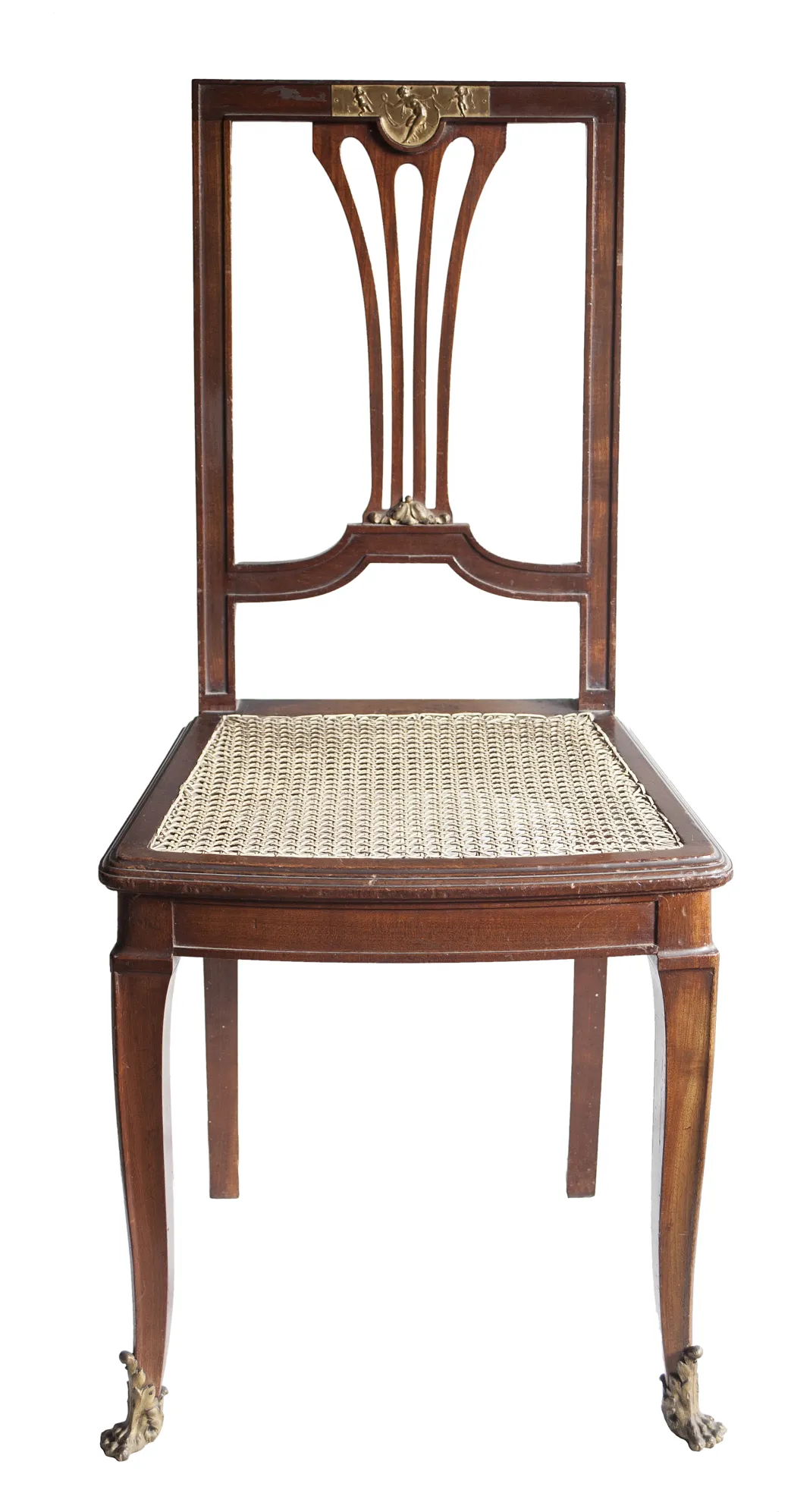 Front view of 2 antique chairs with an elegant decorated backrest and detailed legs