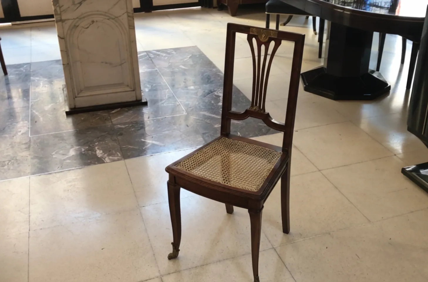 two elegant antique chairs in a classic setting