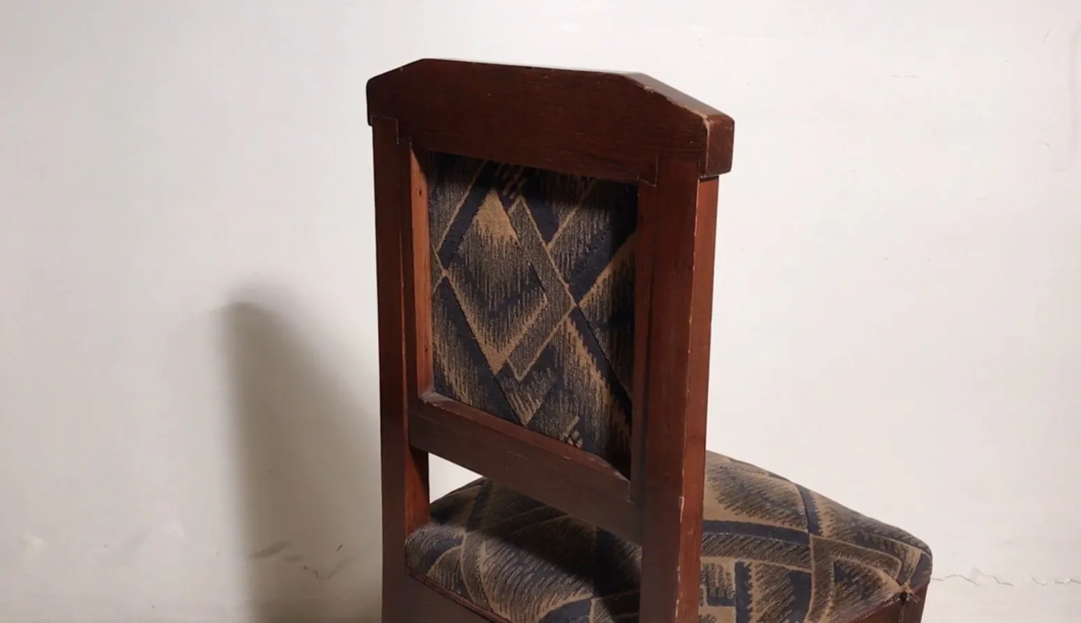 2 antique chairs for restoration in a neutral setting