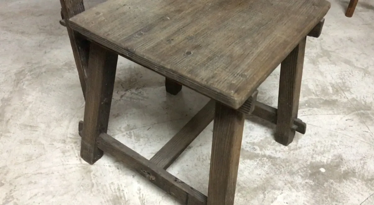 antique chair by jean michel frank with wooden surface