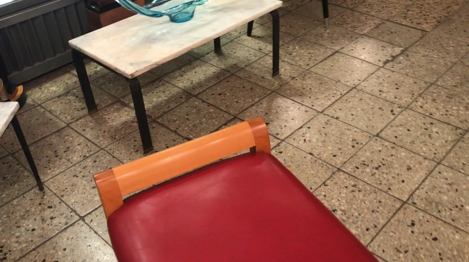 red antique stool with wooden details, dining area setting
