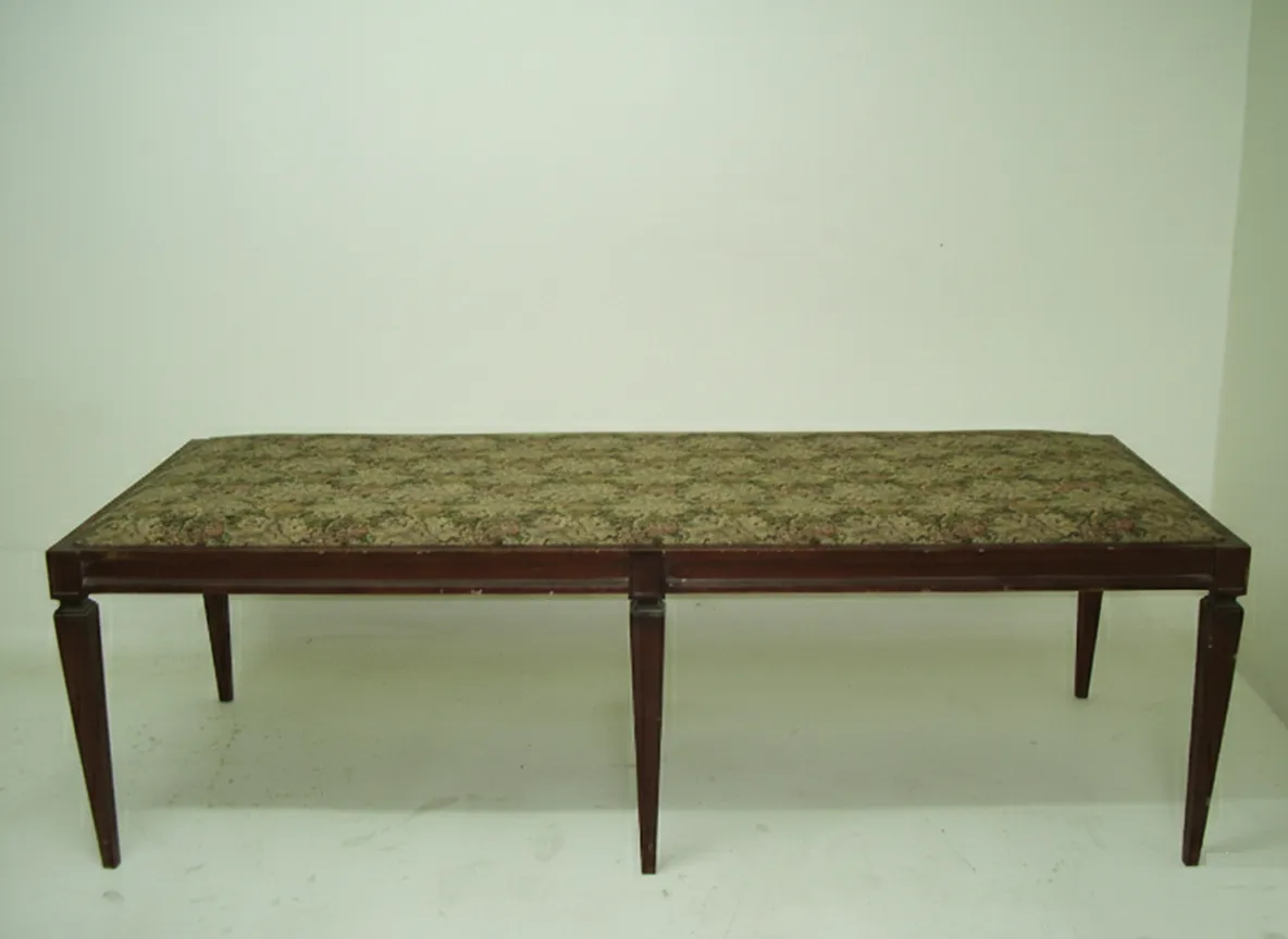 elegant antique stool with thin legs and decorative top