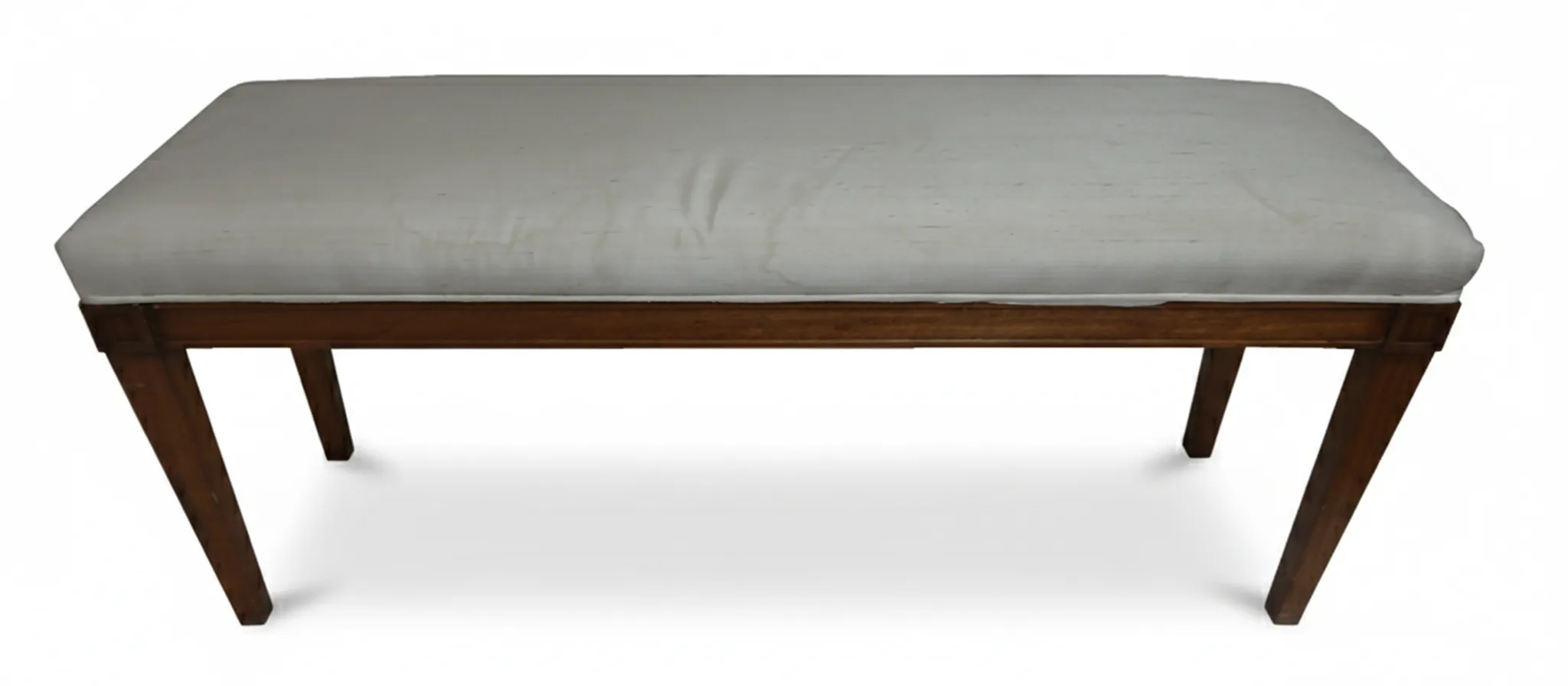 Antique decorative sidewalk bench with light cushion, classic style.