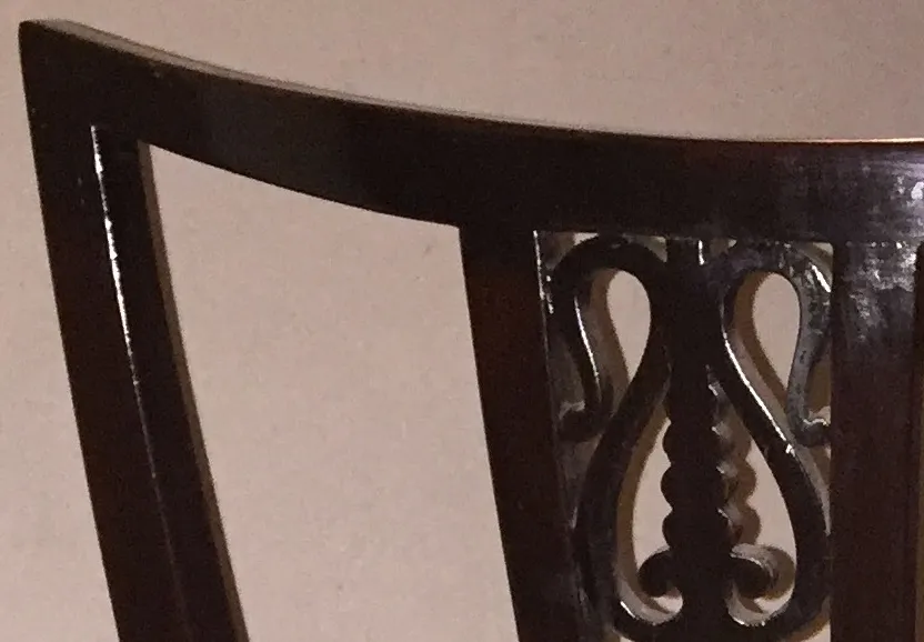 Set of 6 antique chairs and 2 armchairs featuring decorative details, perfect for restoration, in a cozy setting.