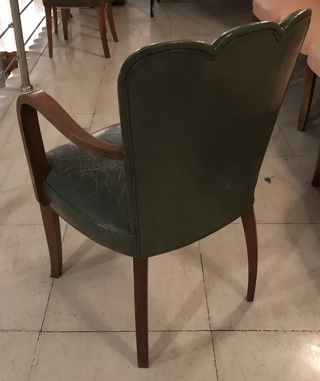 set of 6 green chairs and 2 armchairs in vintage setting