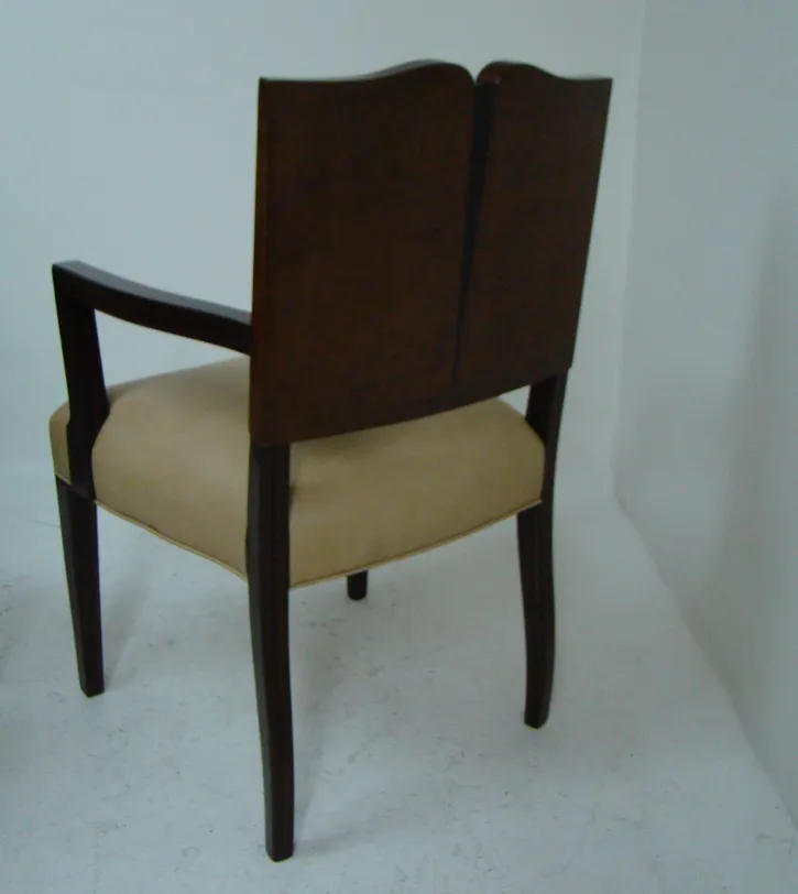 Antique Art Deco armchair in brown with light seating. Minimalist environment.