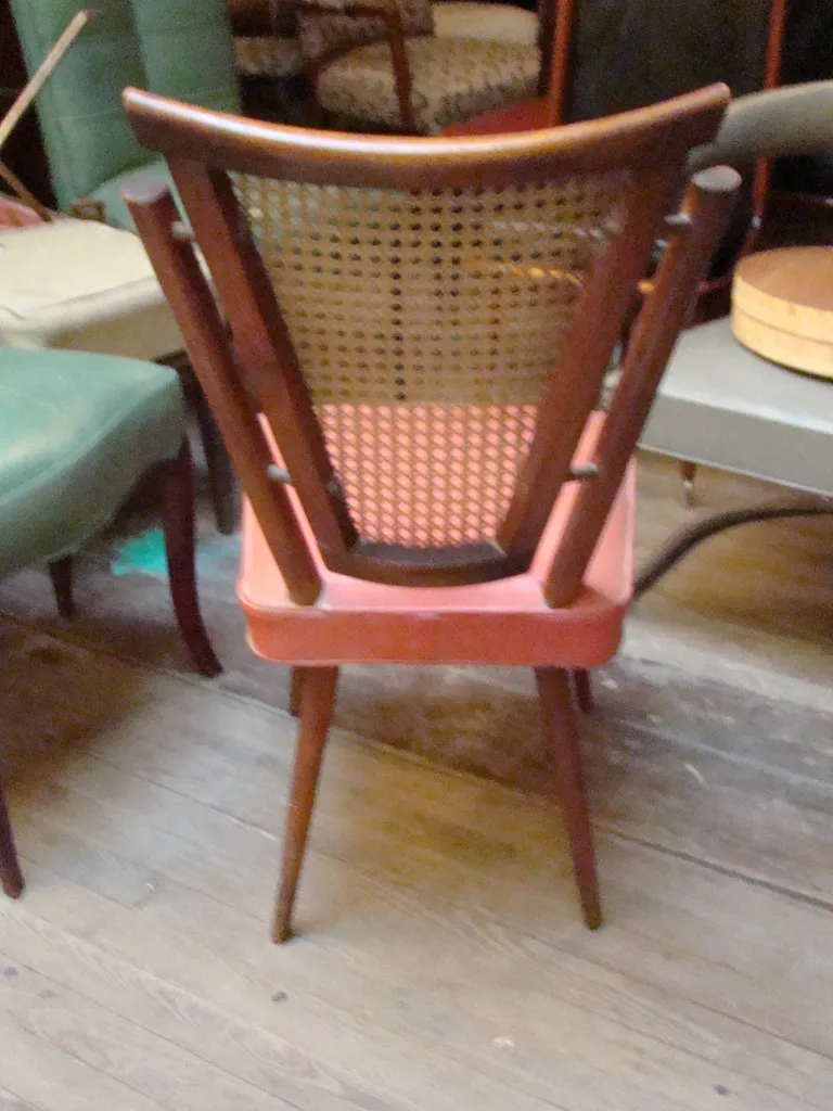 Antique chairs in various colors and shapes, classic setting