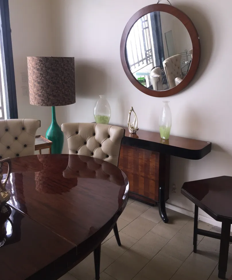 Set of 6 antique chairs in an elegant room with decor.