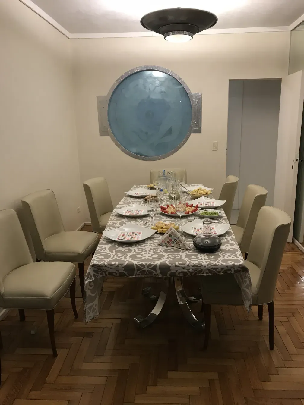 10 antique chairs in an elegant dining room setting