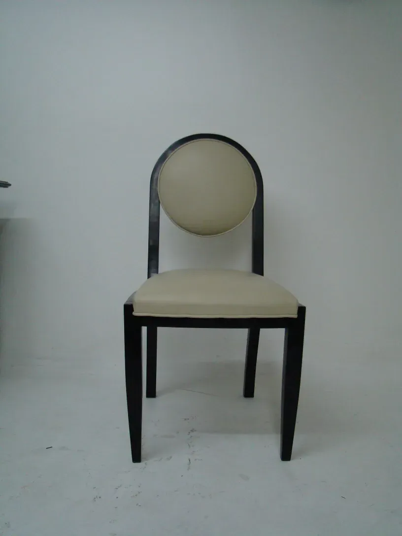 12 antique chairs with contemporary design in a neutral setting