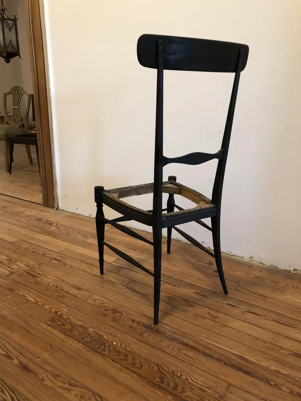 10 antique chairs in a restoration environment