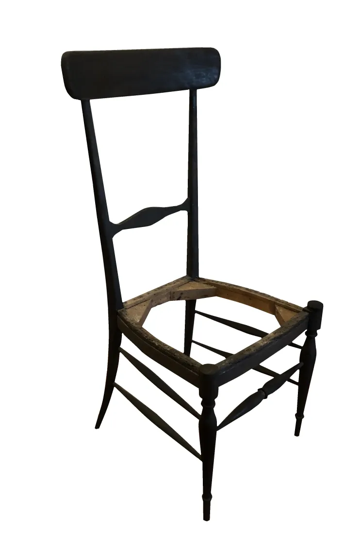 Antique chairs in various conditions for restoration, featuring unique design, placed in a neutral setting.