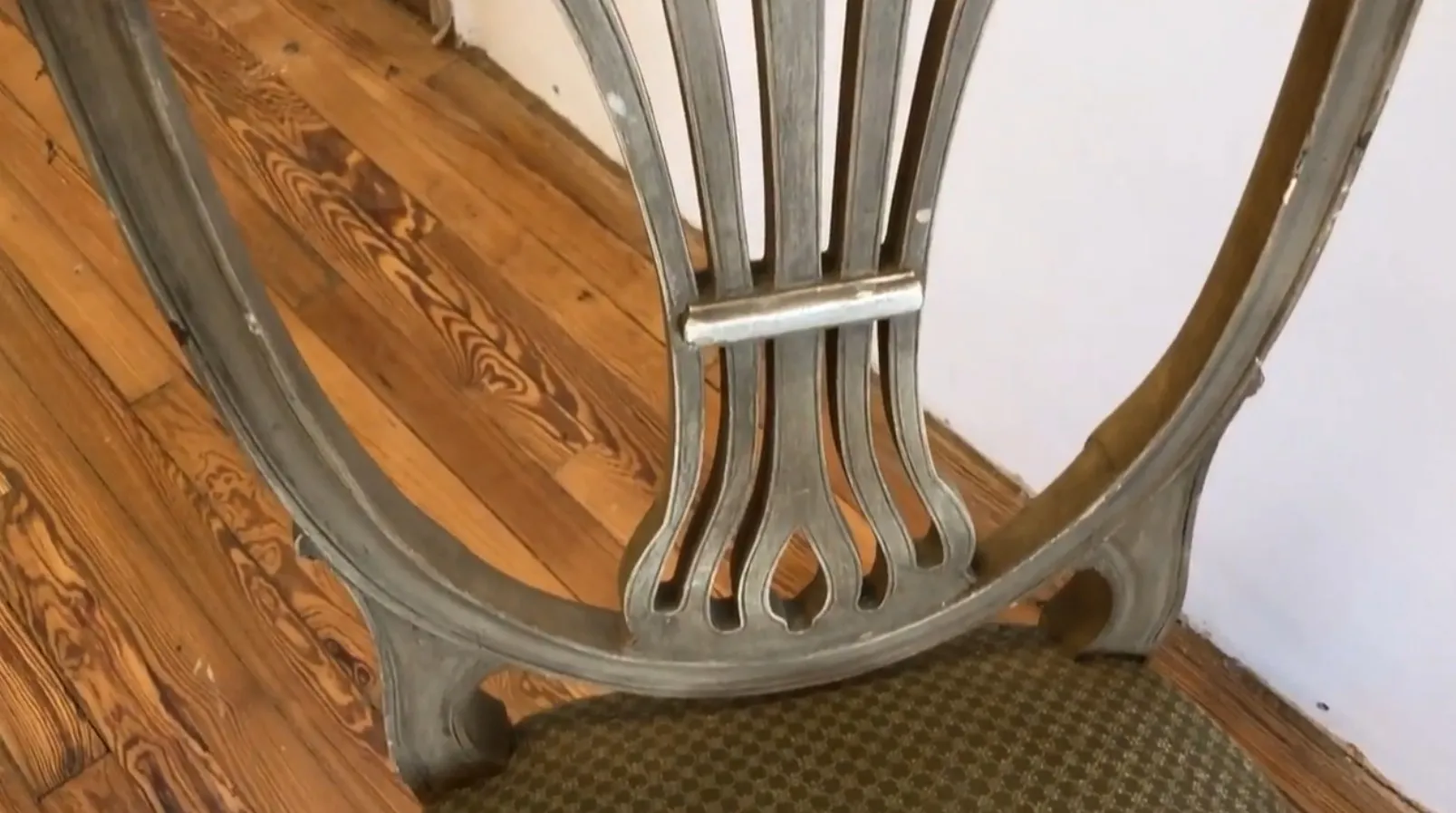 10 antique maison jansen chairs on a light wood floor