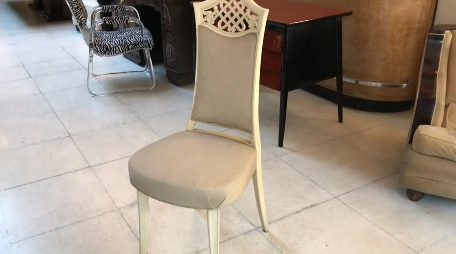 Set of 12 antique chairs for restoration in a vintage setting