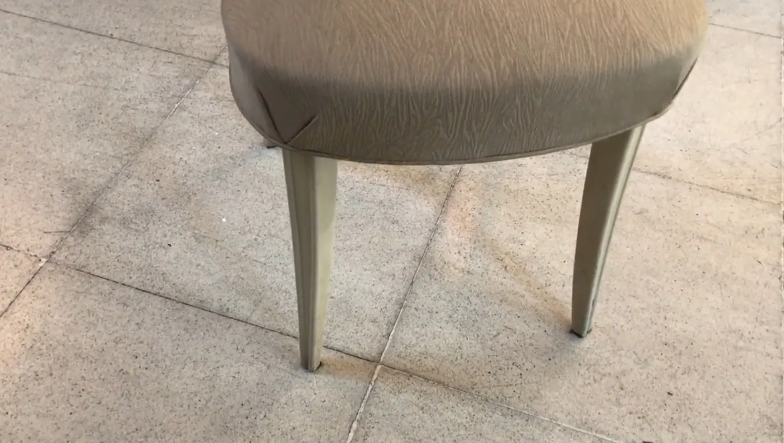 Detailed view of antique chairs to restore in a neutral setting.