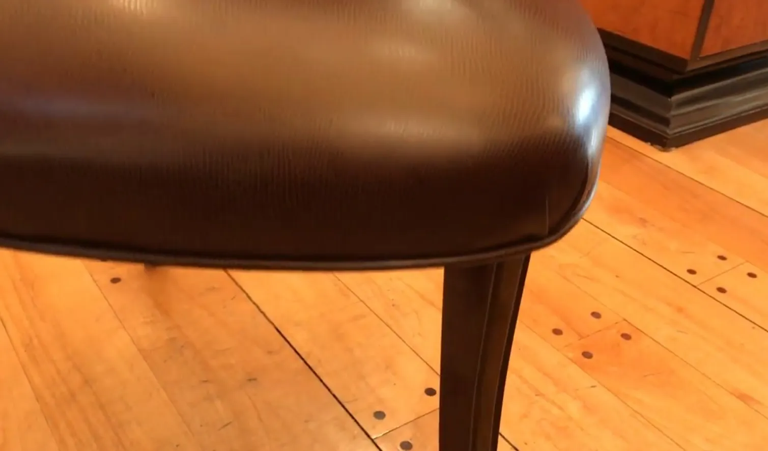 close-up of antique chairs on wooden floor