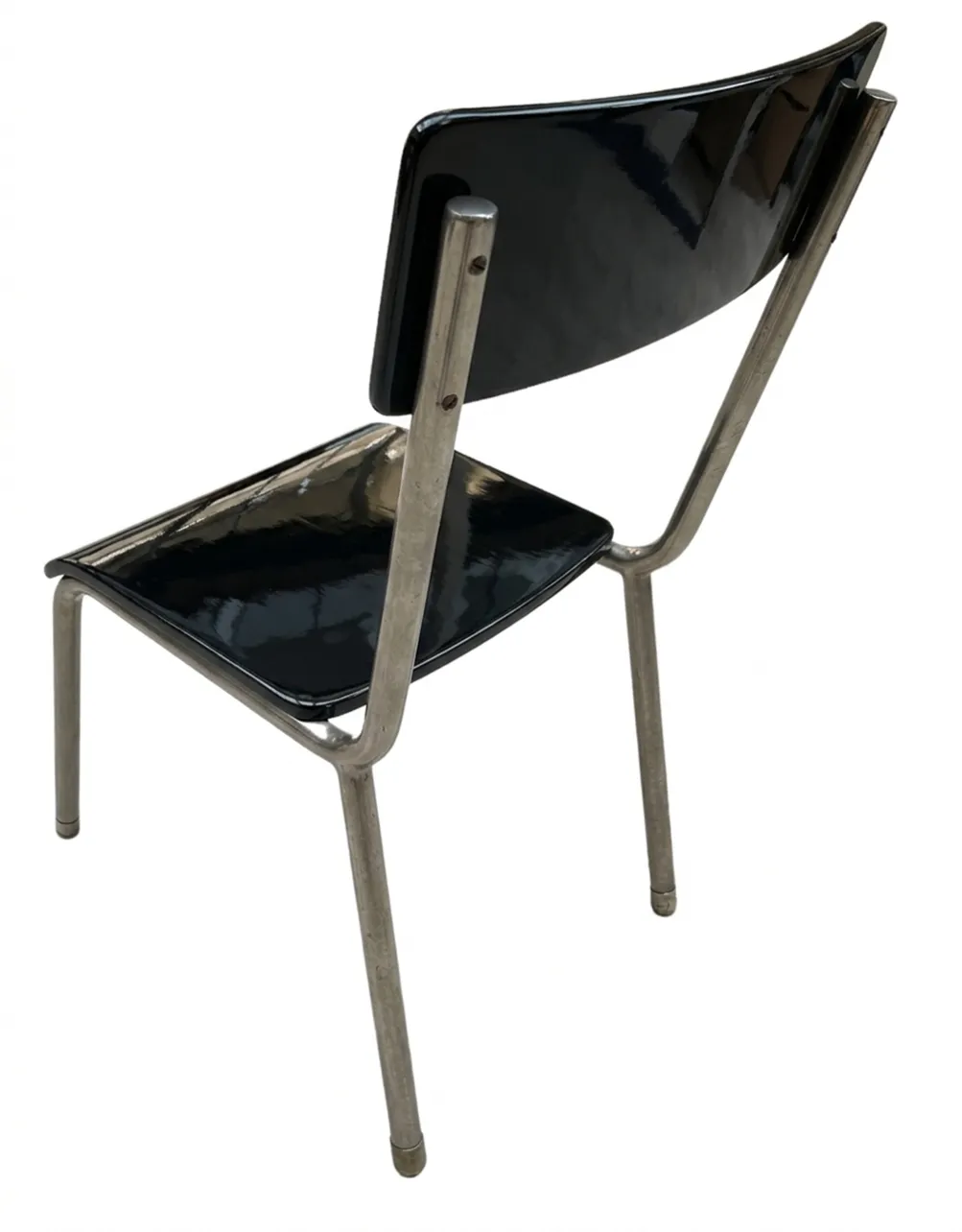 Vista posteriore di 4 sedie Bauhaus antiche di colore nero lucido.