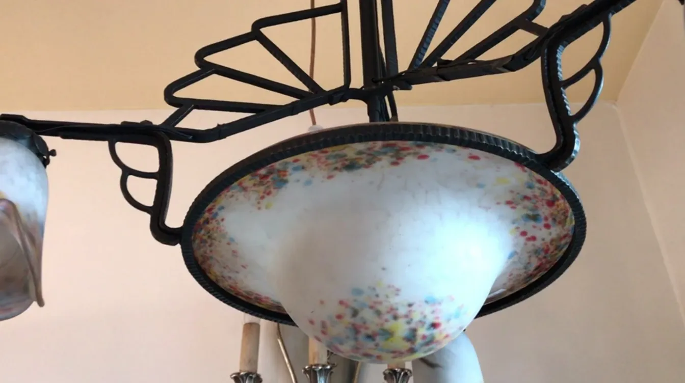 antique Schneider hanging lamp with colorful details, in a cozy environment