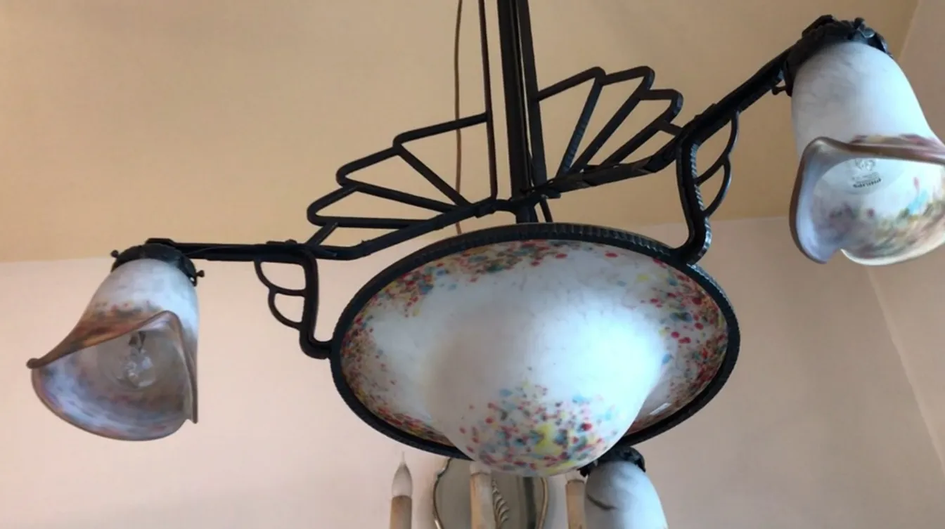 Antique hanging lamp with colorful details on the shades.