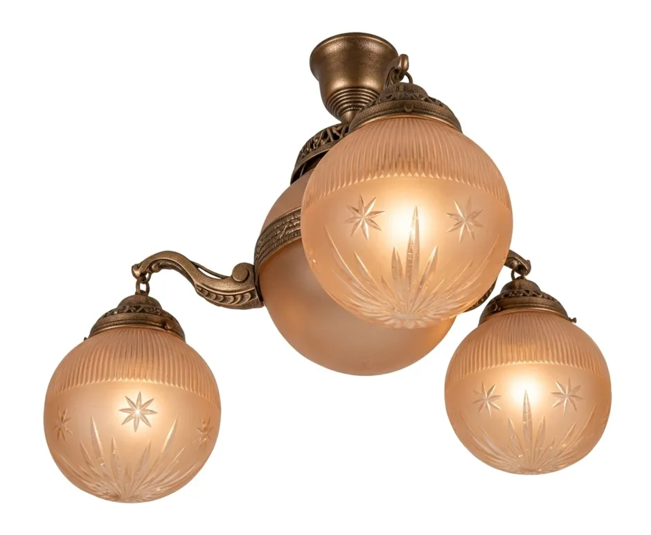 antique hanging lamp with frosted globes in a cozy setting