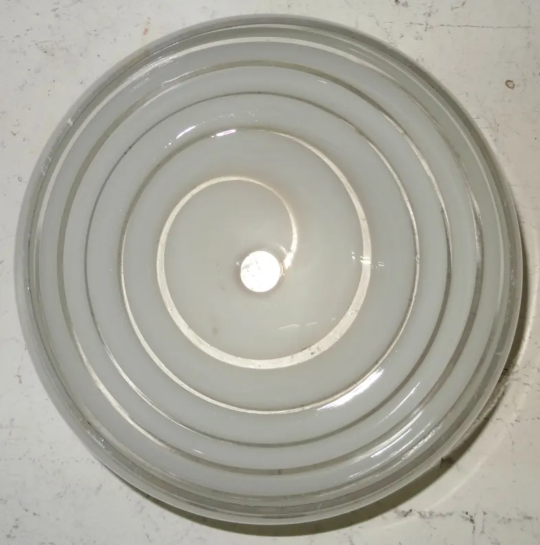 antique hanging lamp with special design and spiral levels, suspended in a soft environment