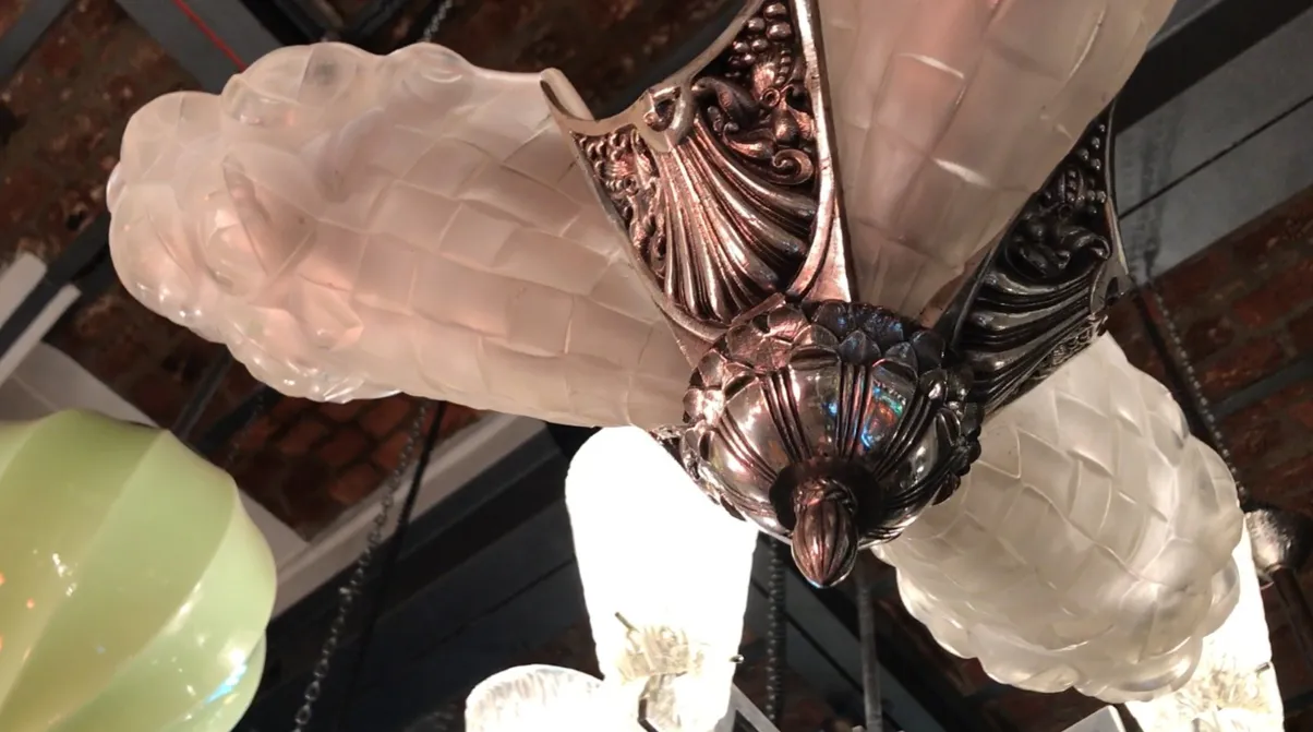 Antique Degue hanging lamp with three lights and decorative design.