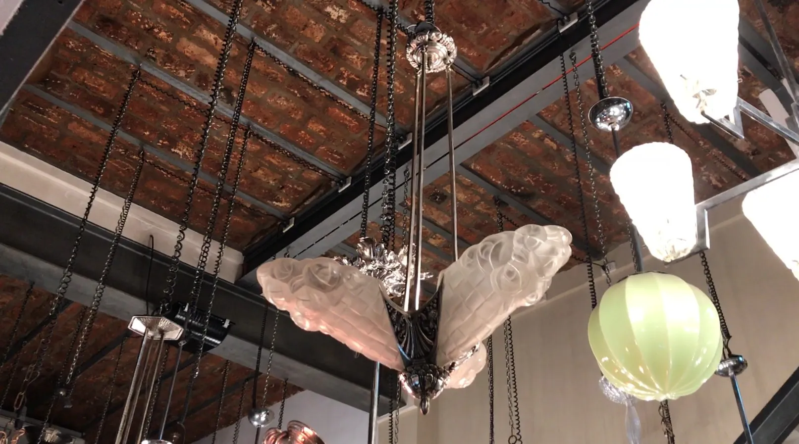 Antique hanging lamp Degue with intricate decorative design, elegant ambiance.