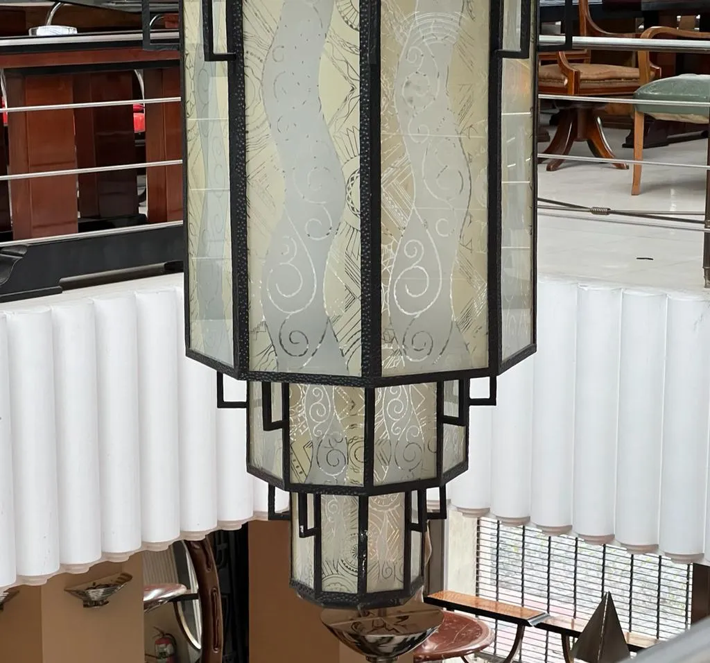 antique decorative lantern made of glass, hanging in a classic setting