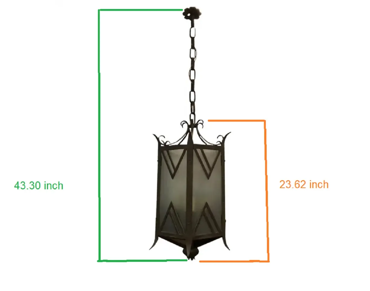 Antique metal hanging lantern with a rectangular shape in an elegant setting.
