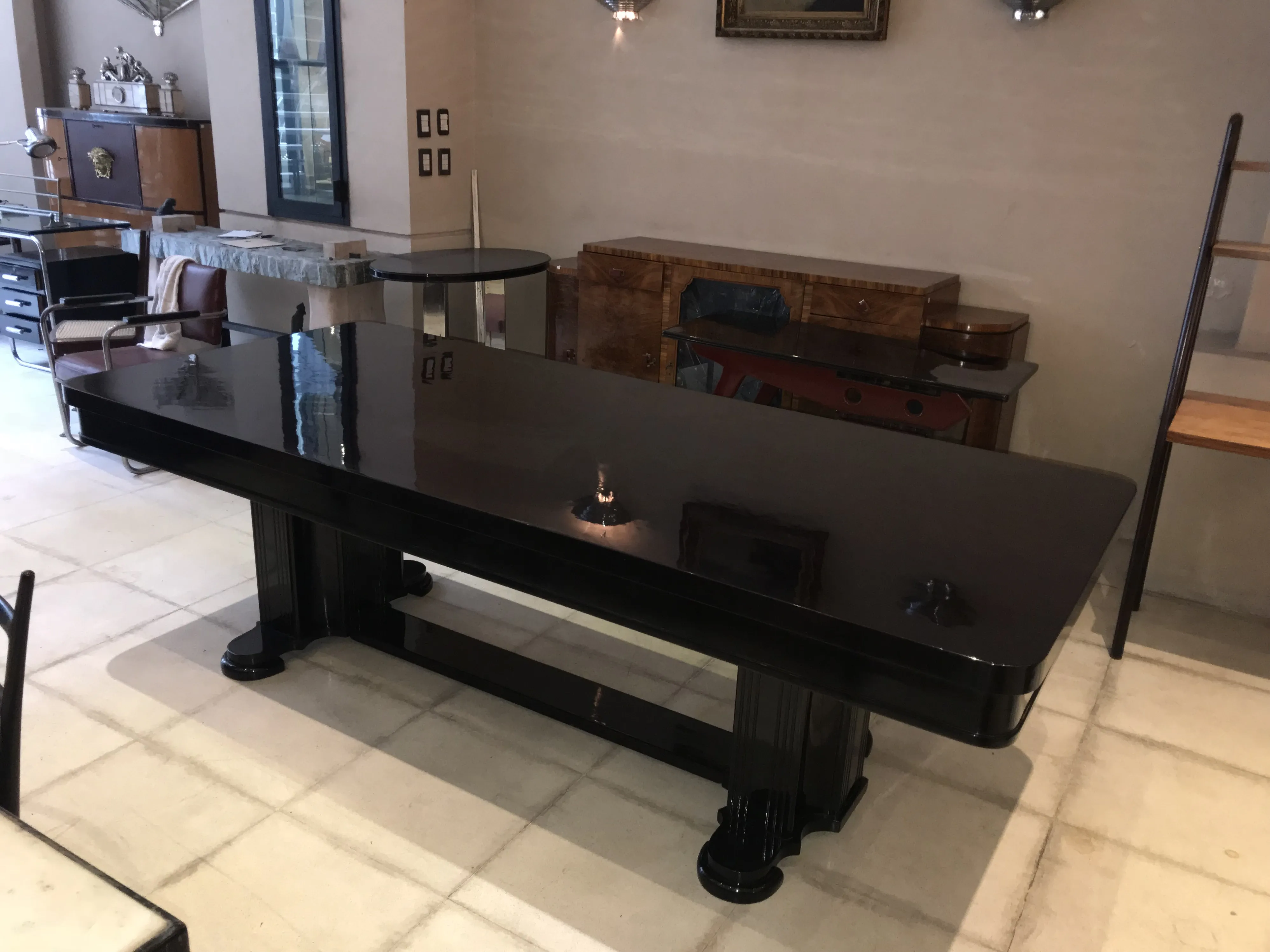 Antique dining table with Art Deco design for 10 people, in an elegant setting