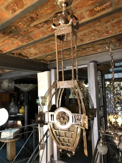 Antique hanging lamp with detailed and elegant design, classic vibe.