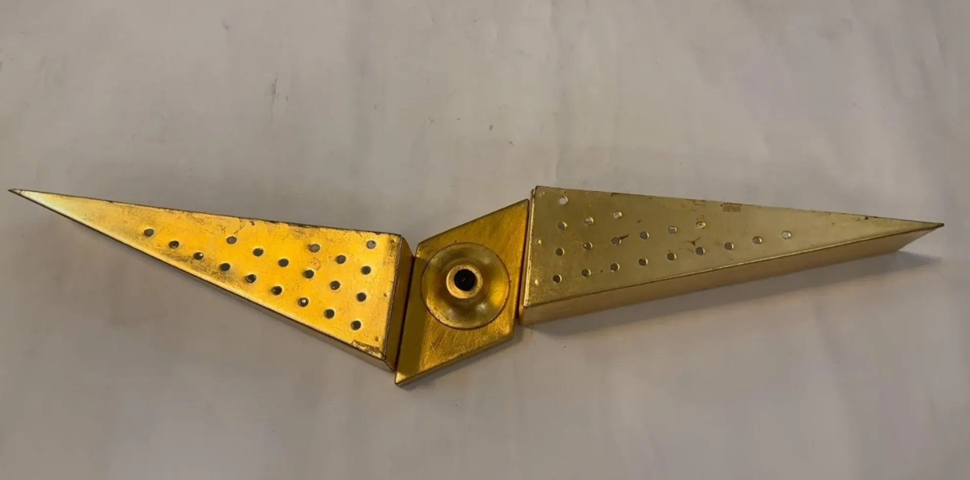 Antique sconce with geometric design and golden finish