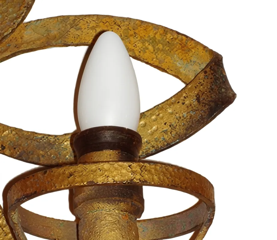 Antique sconces with Art Deco design, gold color and elegant shapes, perfect for vintage decor.